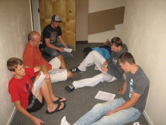 A group of students and leaders prepares to meet with an atheist.
